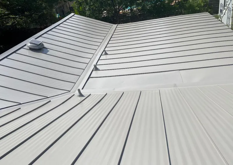 Solar attic fan installed on a metal roof for Roof Ventilation in Las Vegas
